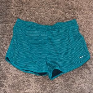 Turquoise Nike shorts (shorts built in)